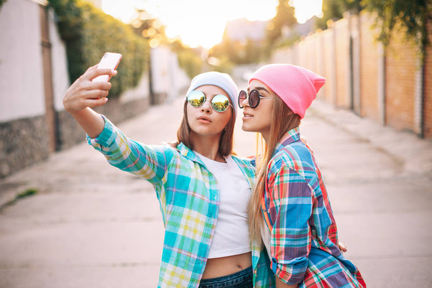 Girls taking selfie on the street - Фото, зображення