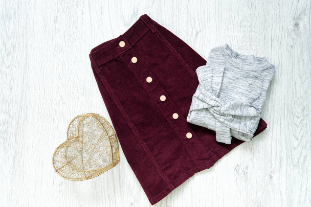 Burgundy suede skirt and gray sweater. Fashionable concept. - Photo, Image