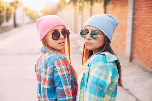 Young girls in shirts on the street  - 写真・画像