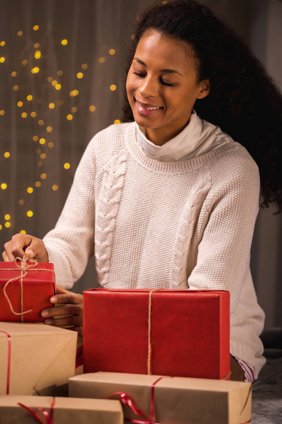 Young woman surrounded by presents - Photo, Image