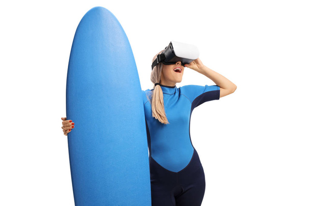woman in a wetsuit using a VR headset - Fotoğraf, Görsel