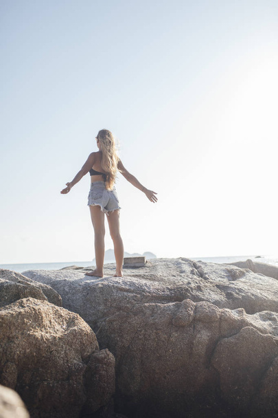 Woman Vacationer Enjoying Summertime By the Sea - Фото, изображение