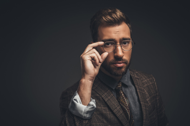man adjusting glasses - Photo, Image