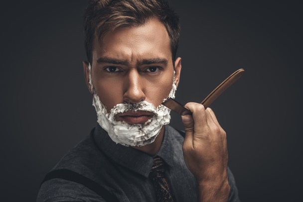 man shaving with straight razor - Photo, Image