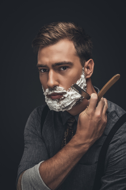 man shaving with straight razor - Foto, immagini