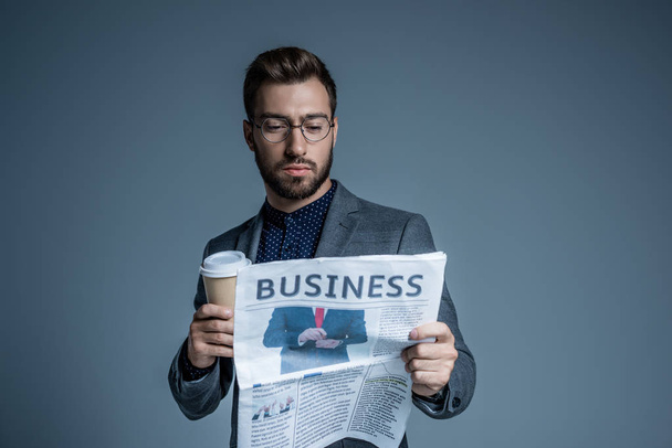 Businessman reading newspaper - Фото, зображення