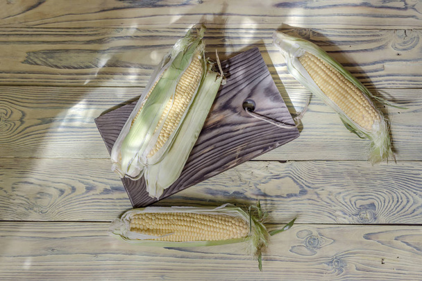 Corn on a wooden table  - Photo, Image