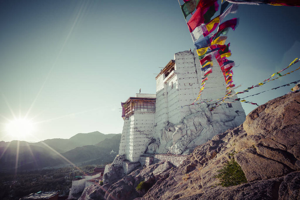 Prayer tibetan flags near the Namgyal Tsemo Monastery in Leh, La - Photo, Image