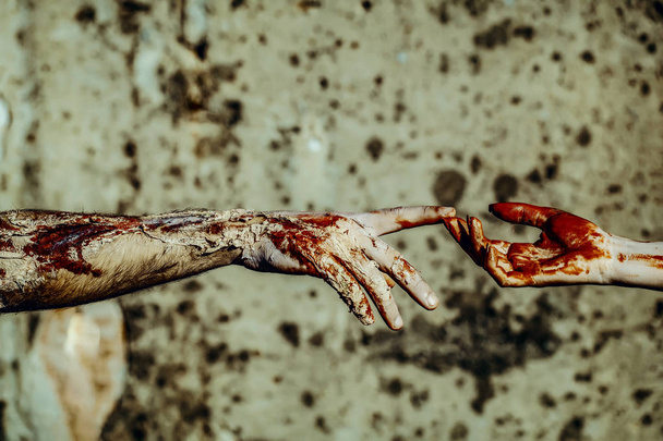 Halloween female and male hands connecting - 写真・画像
