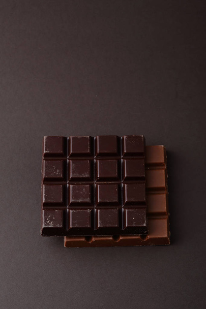 Two bars of chocolate on dark - Fotó, kép