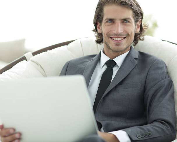 close-up of smiling businesswoman working with laptop in living room. - Foto, Imagem