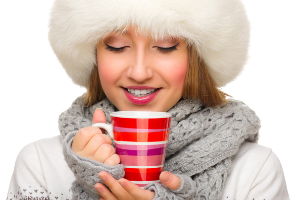 Young girl with sweater and mug isolated - Foto, imagen