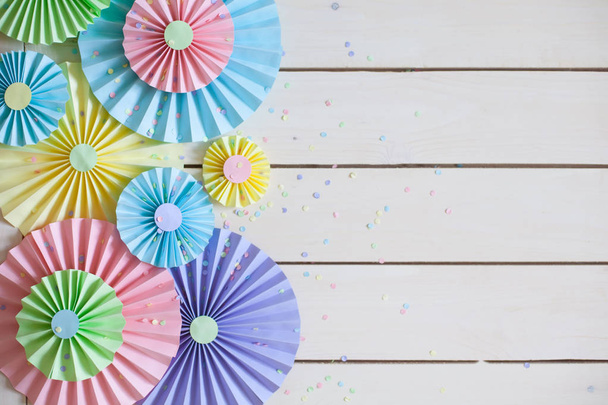 Colorful bright pastel paper rosette. Decorating for a party. - Foto, imagen