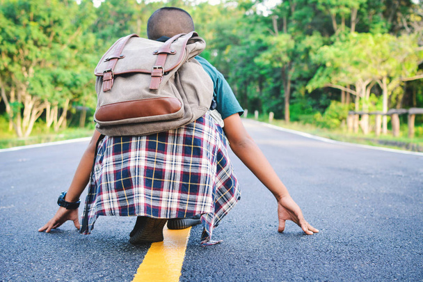 Happy Asian boy backpack in the road and forest background - Foto, imagen