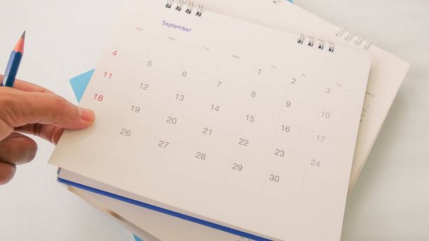 Blurred calendar page on white background. - Photo, Image