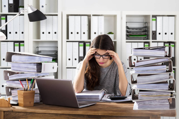 Worried Businesswoman Working At Office - Photo, image