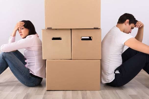 Tired Couple Near Boxes   - Foto, Imagen
