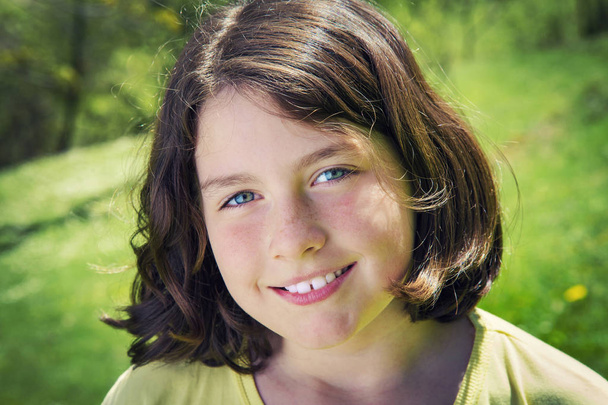 Portrait of a teenage girl smiling - Foto, imagen