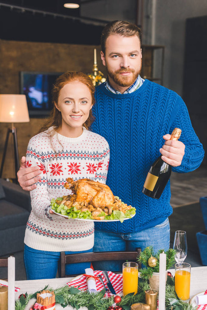 couple with champagne and friend chicken - Photo, Image