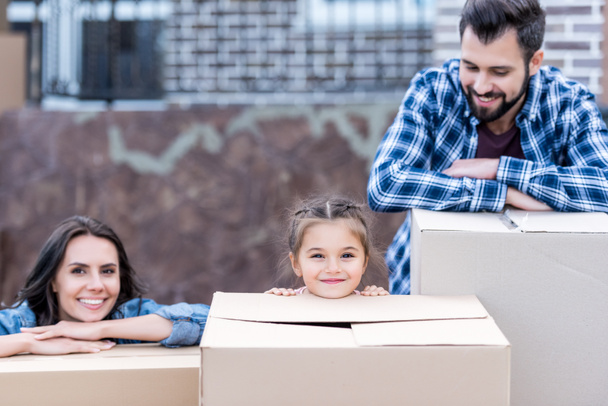 young family with boxes - Photo, Image