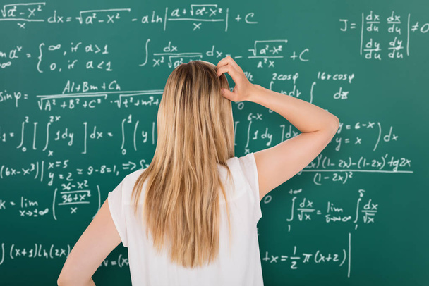 Girl Looking At Blackboard  - Fotoğraf, Görsel