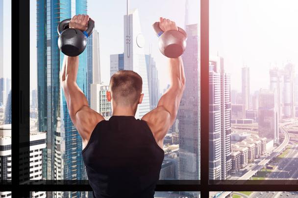 Muscular Man Training With Kettles  - Zdjęcie, obraz