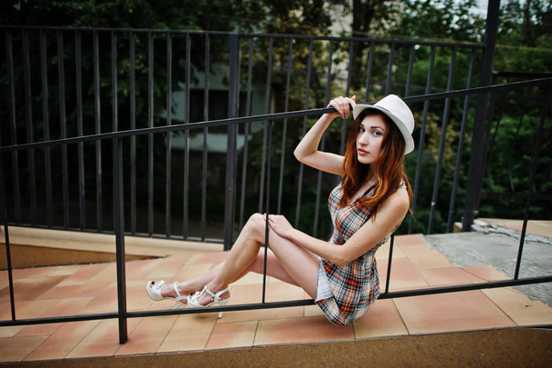 Amazing long legs with hig heels girl wear on hat posing near th - Foto, Imagem
