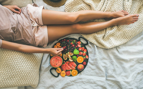 Girl with tray full of seasonal fruits - Zdjęcie, obraz