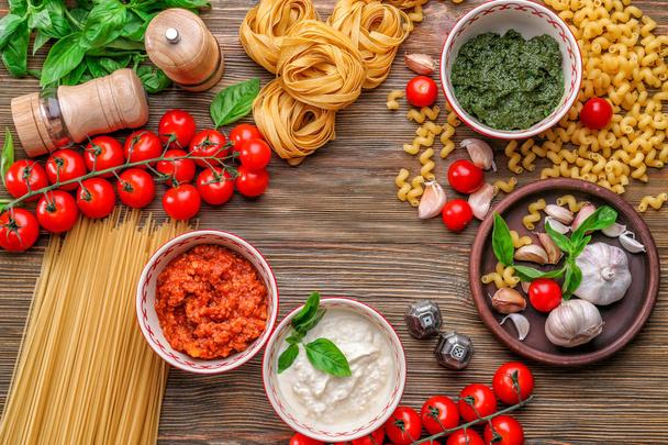 Composition with pesto, bolognese and white sauces for pasta - Valokuva, kuva