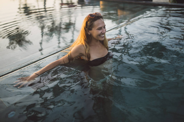 Woman Enjoying in the Swimming Pool - Fotó, kép