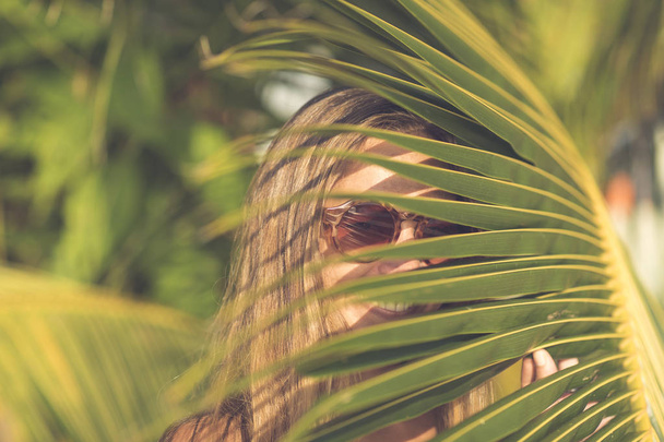 Woman Hiding in Palm Leaves - Foto, Imagem