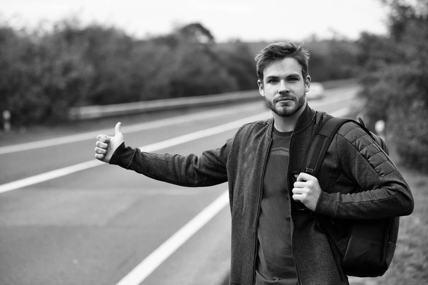 Young man hitchhiking - Photo, Image