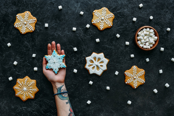 hand with homemade christmas gingerbreads - Photo, Image