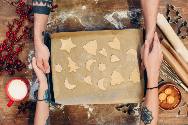 christmas cookies on baking paper - Fotó, kép