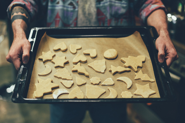 person baking christmas cookies - Fotó, kép