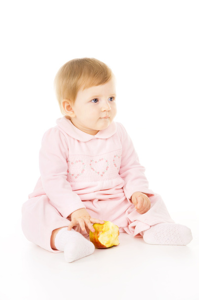 小さな赤ちゃんは、リンゴを食べる - 写真・画像
