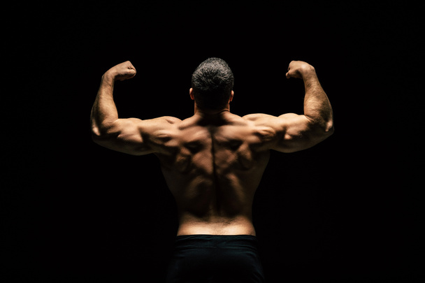 shirtless sportive man showing muscles - Valokuva, kuva