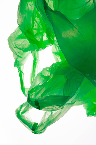 Green plastic bag  - Фото, изображение