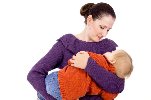 Mama lulls a child in her arms - Zdjęcie, obraz