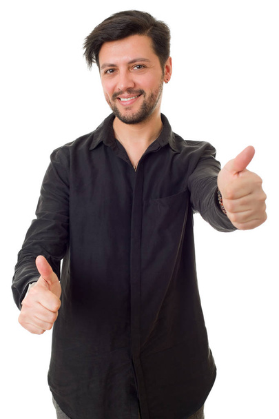 Young casual man going thumbs up, isolated on white - Foto, Bild