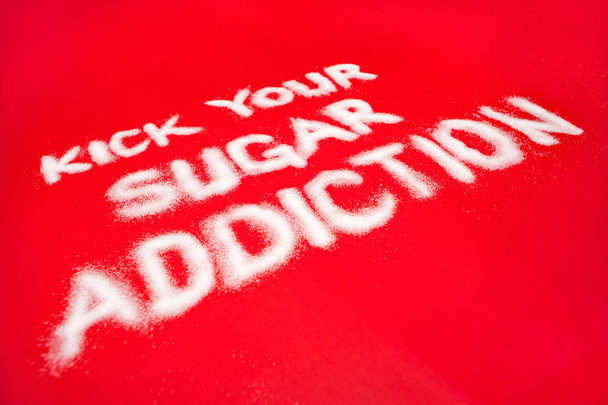 Sugar addiction concept on red background - Foto, Bild