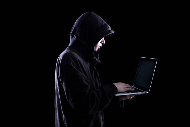 Anonymous hacker in the dark - Фото, изображение