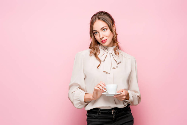 The serious frustrated young beautiful business woman on pink background - Φωτογραφία, εικόνα