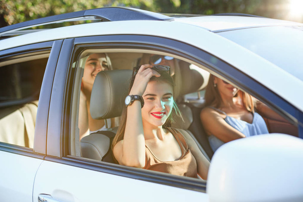 The young women in the car smiling - Foto, imagen