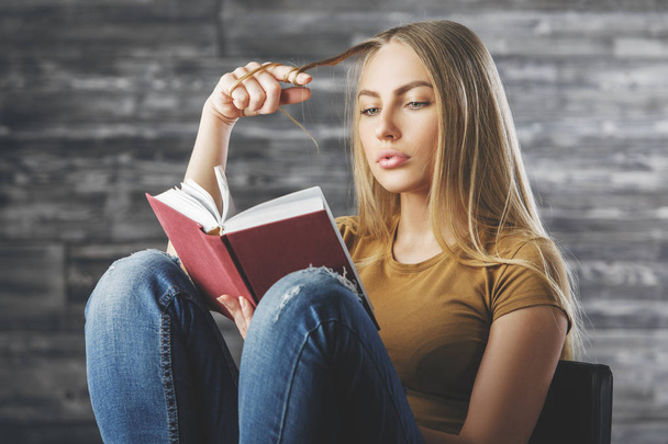 Attractive woman reading book  - Фото, изображение