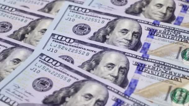Antecedentes de los nuevos billetes de cien dólares girando
 - Metraje, vídeo