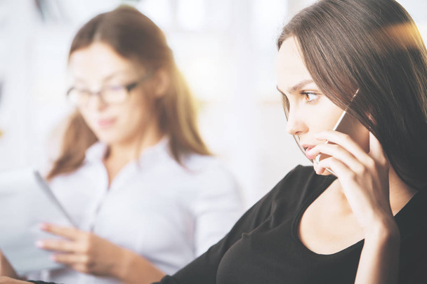 Attractive businesswomen talking on phone - Fotografie, Obrázek