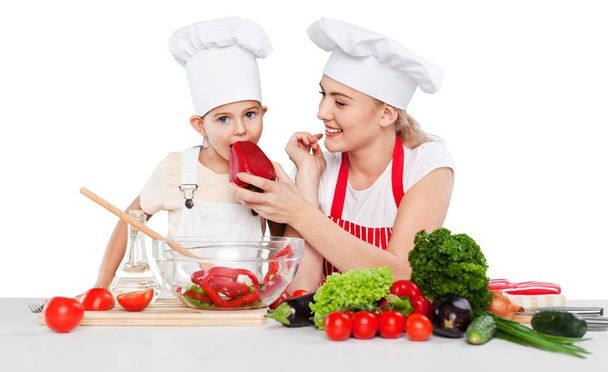 Girl and her mother cooking together - Φωτογραφία, εικόνα
