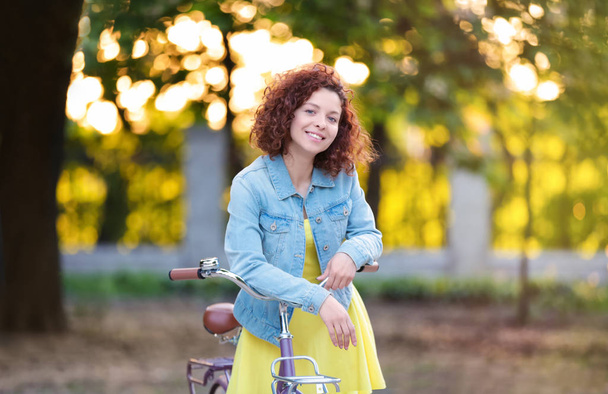 young woman with bicycle - Photo, image