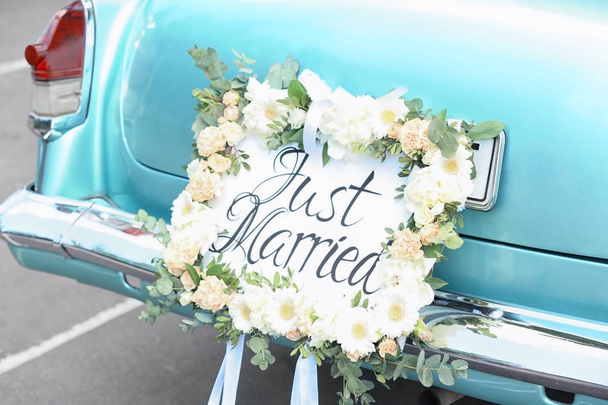 Beautiful wedding car with plate JUST MARRIED outdoors - Fotó, kép